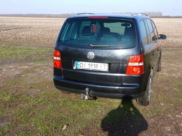Черный Фольксваген Туран, объемом двигателя 2 л и пробегом 290 тыс. км за 6000 $, фото 2 на Automoto.ua