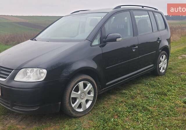 Черный Фольксваген Туран, объемом двигателя 1.6 л и пробегом 200 тыс. км за 5500 $, фото 4 на Automoto.ua