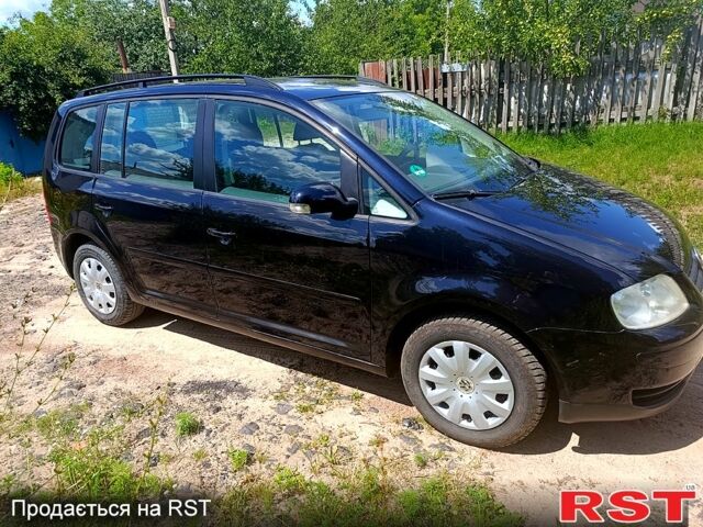 Черный Фольксваген Туран, объемом двигателя 1.6 л и пробегом 223 тыс. км за 5900 $, фото 1 на Automoto.ua