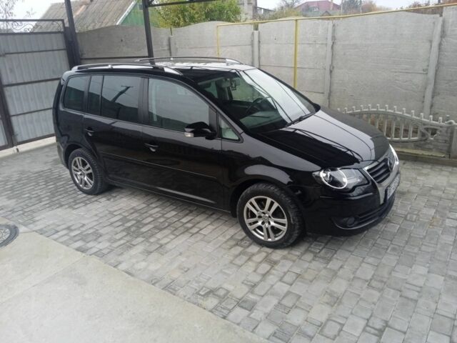 Черный Фольксваген Туран, объемом двигателя 1.4 л и пробегом 218 тыс. км за 6500 $, фото 1 на Automoto.ua