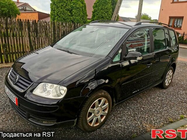 Черный Фольксваген Туран, объемом двигателя 2 л и пробегом 211 тыс. км за 2200 $, фото 1 на Automoto.ua