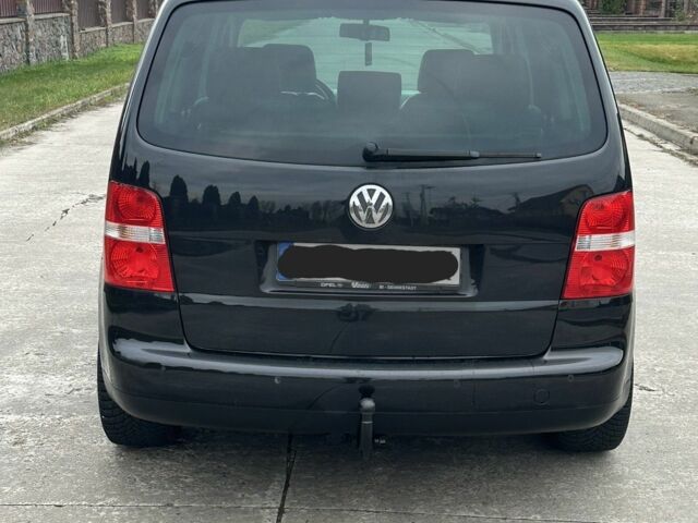 Черный Фольксваген Туран, объемом двигателя 2 л и пробегом 111 тыс. км за 4000 $, фото 4 на Automoto.ua