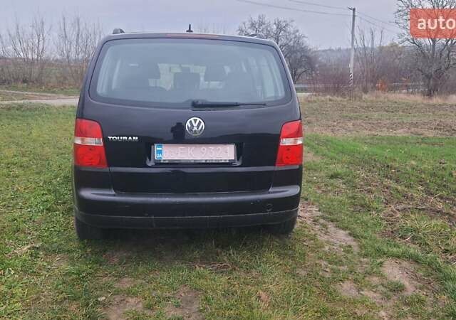 Черный Фольксваген Туран, объемом двигателя 1.6 л и пробегом 200 тыс. км за 5500 $, фото 7 на Automoto.ua