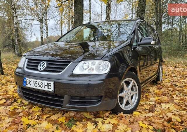 Черный Фольксваген Туран, объемом двигателя 1.39 л и пробегом 278 тыс. км за 5200 $, фото 1 на Automoto.ua