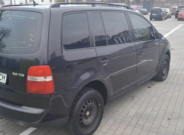 Черный Фольксваген Туран, объемом двигателя 2 л и пробегом 485 тыс. км за 4550 $, фото 1 на Automoto.ua