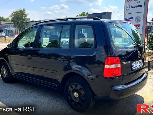 Черный Фольксваген Туран, объемом двигателя 1.4 л и пробегом 293 тыс. км за 3400 $, фото 2 на Automoto.ua