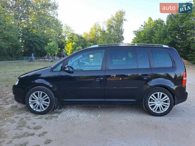 Чорний Фольксваген Туран, об'ємом двигуна 1.97 л та пробігом 291 тис. км за 7000 $, фото 1 на Automoto.ua