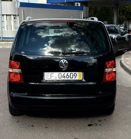 Черный Фольксваген Туран, объемом двигателя 1.6 л и пробегом 190 тыс. км за 6999 $, фото 66 на Automoto.ua