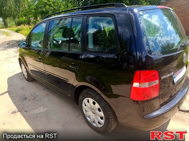 Черный Фольксваген Туран, объемом двигателя 1.6 л и пробегом 223 тыс. км за 5900 $, фото 3 на Automoto.ua