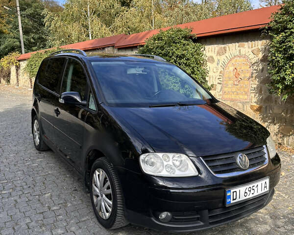 Черный Фольксваген Туран, объемом двигателя 2 л и пробегом 281 тыс. км за 5199 $, фото 4 на Automoto.ua