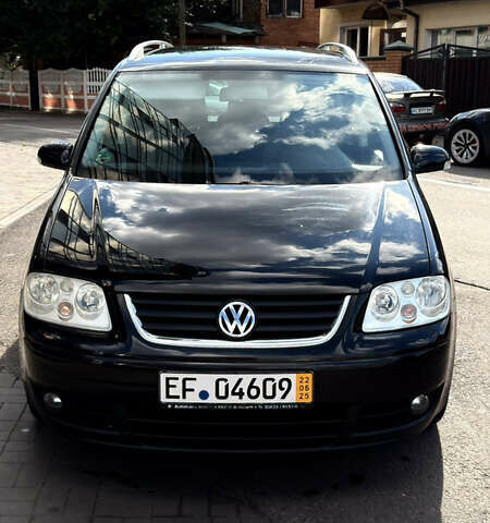 Черный Фольксваген Туран, объемом двигателя 1.6 л и пробегом 190 тыс. км за 6999 $, фото 78 на Automoto.ua