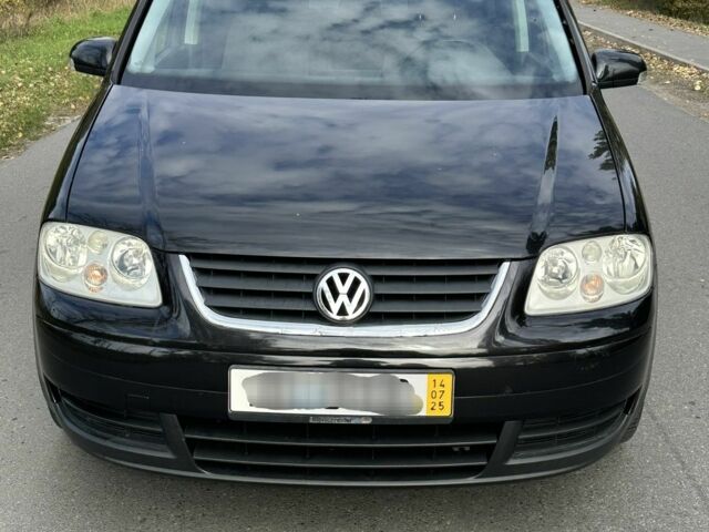 Черный Фольксваген Туран, объемом двигателя 1.9 л и пробегом 290 тыс. км за 3600 $, фото 4 на Automoto.ua