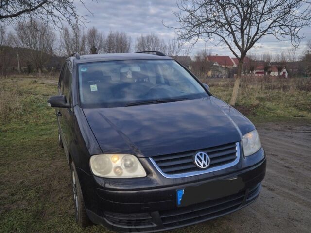 Черный Фольксваген Туран, объемом двигателя 1.9 л и пробегом 217 тыс. км за 2550 $, фото 1 на Automoto.ua