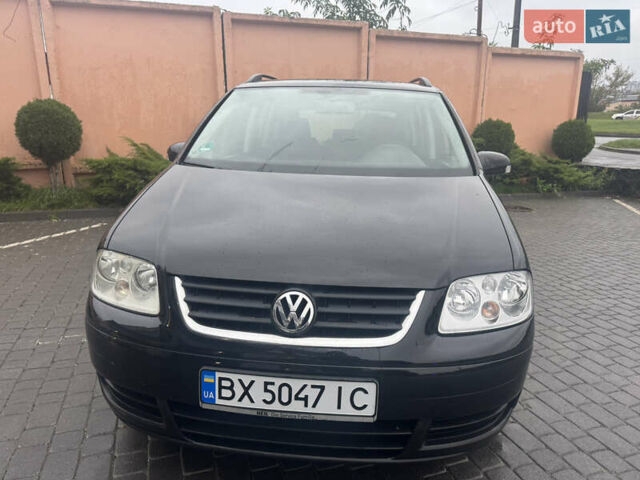 Черный Фольксваген Туран, объемом двигателя 1.9 л и пробегом 246 тыс. км за 7800 $, фото 1 на Automoto.ua