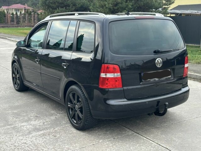Черный Фольксваген Туран, объемом двигателя 2 л и пробегом 111 тыс. км за 4000 $, фото 2 на Automoto.ua