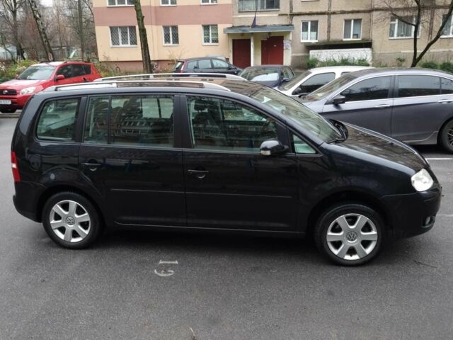 Черный Фольксваген Туран, объемом двигателя 1.4 л и пробегом 239 тыс. км за 5700 $, фото 2 на Automoto.ua
