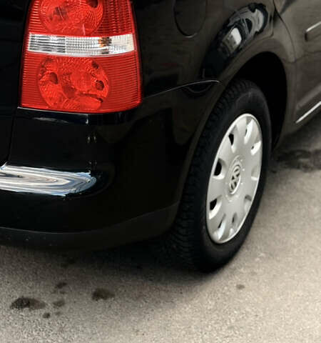 Черный Фольксваген Туран, объемом двигателя 1.6 л и пробегом 190 тыс. км за 6999 $, фото 61 на Automoto.ua