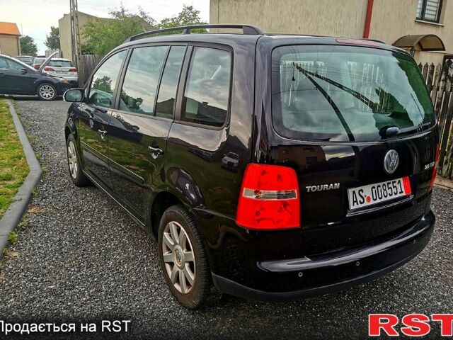 Черный Фольксваген Туран, объемом двигателя 2 л и пробегом 211 тыс. км за 2200 $, фото 2 на Automoto.ua