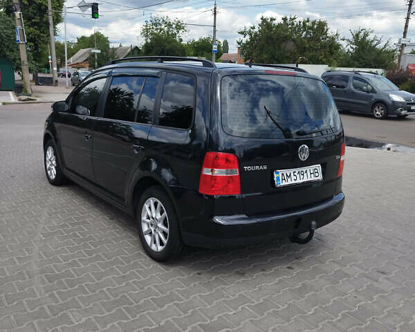 Черный Фольксваген Туран, объемом двигателя 1.9 л и пробегом 217 тыс. км за 7700 $, фото 3 на Automoto.ua