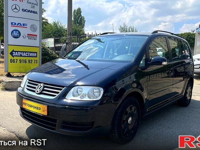 Черный Фольксваген Туран, объемом двигателя 1.4 л и пробегом 293 тыс. км за 3400 $, фото 1 на Automoto.ua