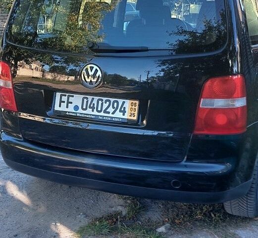 Черный Фольксваген Туран, объемом двигателя 1.6 л и пробегом 238 тыс. км за 5900 $, фото 8 на Automoto.ua