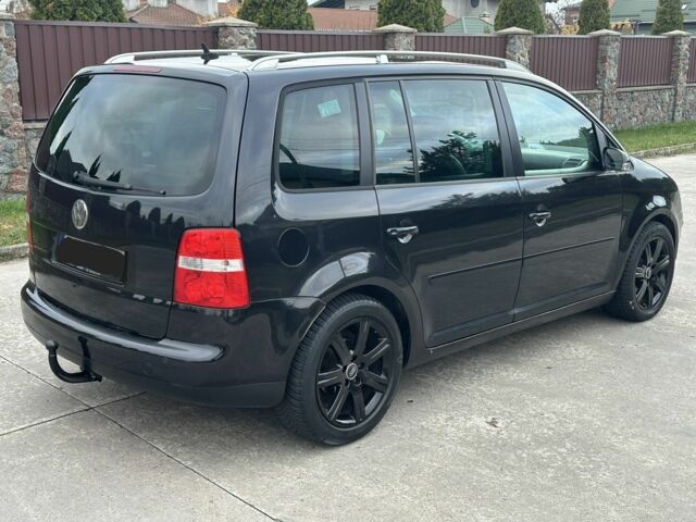 Черный Фольксваген Туран, объемом двигателя 2 л и пробегом 111 тыс. км за 4000 $, фото 3 на Automoto.ua