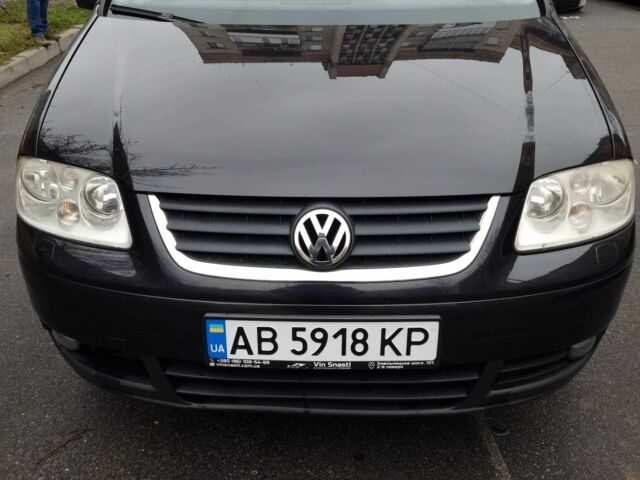 Черный Фольксваген Туран, объемом двигателя 1.4 л и пробегом 239 тыс. км за 5700 $, фото 1 на Automoto.ua