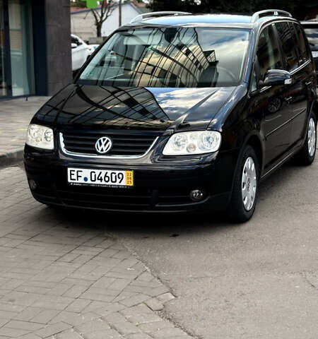 Черный Фольксваген Туран, объемом двигателя 1.6 л и пробегом 190 тыс. км за 6999 $, фото 51 на Automoto.ua