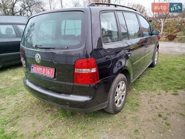 Черный Фольксваген Туран, объемом двигателя 1.6 л и пробегом 225 тыс. км за 6000 $, фото 4 на Automoto.ua