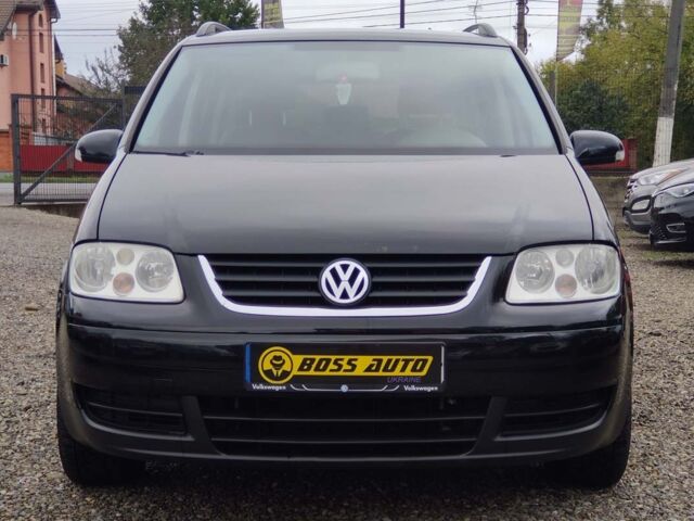 Черный Фольксваген Туран, объемом двигателя 1.6 л и пробегом 289 тыс. км за 5800 $, фото 1 на Automoto.ua