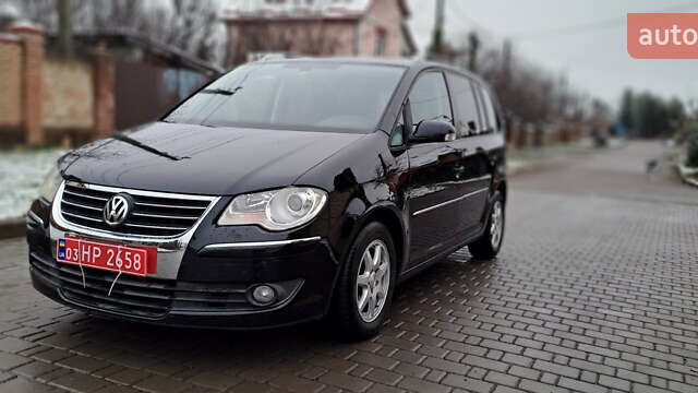 Черный Фольксваген Туран, объемом двигателя 1.4 л и пробегом 193 тыс. км за 6950 $, фото 5 на Automoto.ua