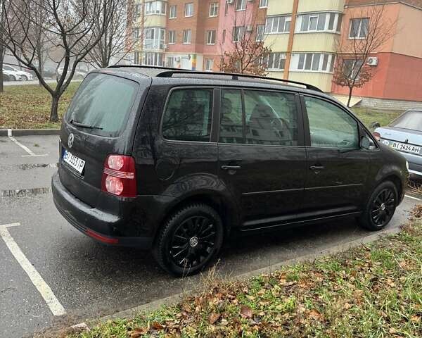 Черный Фольксваген Туран, объемом двигателя 1.97 л и пробегом 314 тыс. км за 7300 $, фото 1 на Automoto.ua