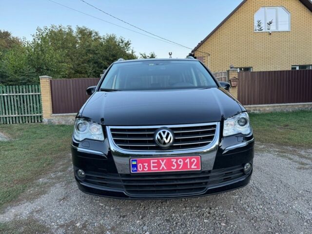 Черный Фольксваген Туран, объемом двигателя 1.4 л и пробегом 205 тыс. км за 7200 $, фото 2 на Automoto.ua