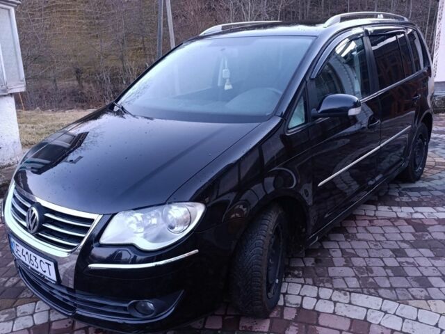Черный Фольксваген Туран, объемом двигателя 2 л и пробегом 320 тыс. км за 6800 $, фото 1 на Automoto.ua