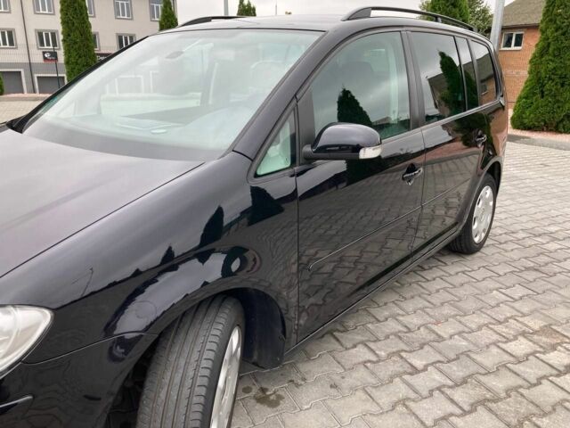 Черный Фольксваген Туран, объемом двигателя 1.4 л и пробегом 196 тыс. км за 6650 $, фото 2 на Automoto.ua