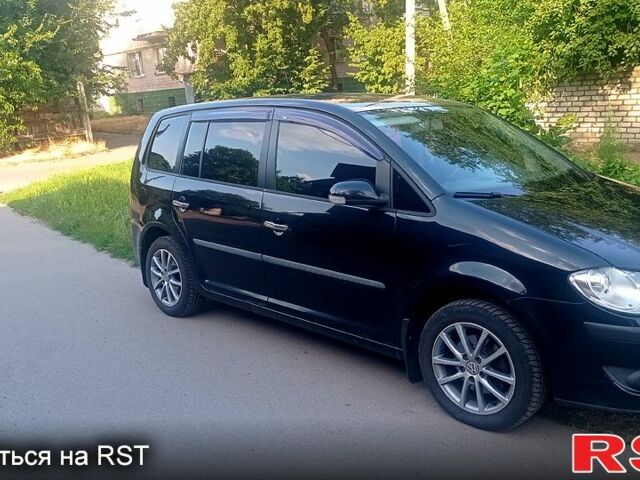 Черный Фольксваген Туран, объемом двигателя 1.4 л и пробегом 233 тыс. км за 6800 $, фото 1 на Automoto.ua