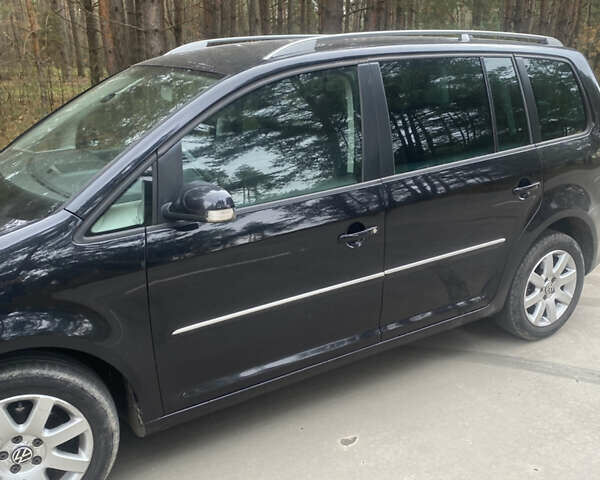 Чорний Фольксваген Туран, об'ємом двигуна 1.39 л та пробігом 187 тис. км за 6500 $, фото 1 на Automoto.ua