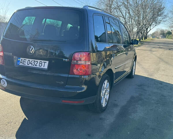 Черный Фольксваген Туран, объемом двигателя 1.4 л и пробегом 217 тыс. км за 8300 $, фото 2 на Automoto.ua
