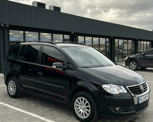 Чорний Фольксваген Туран, об'ємом двигуна 1.9 л та пробігом 124 тис. км за 8700 $, фото 1 на Automoto.ua