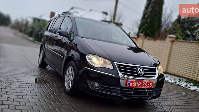 Черный Фольксваген Туран, объемом двигателя 1.4 л и пробегом 193 тыс. км за 6950 $, фото 2 на Automoto.ua