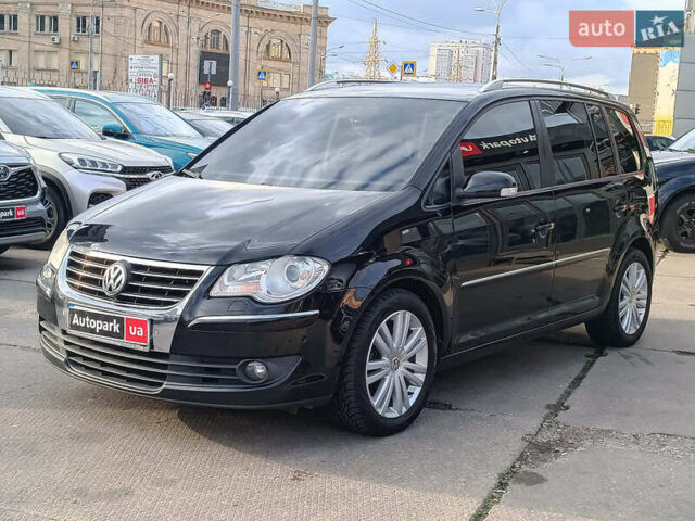 Черный Фольксваген Туран, объемом двигателя 2 л и пробегом 260 тыс. км за 9390 $, фото 2 на Automoto.ua
