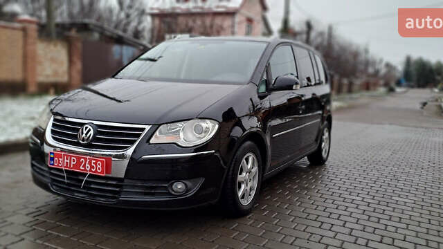 Черный Фольксваген Туран, объемом двигателя 1.4 л и пробегом 193 тыс. км за 6950 $, фото 29 на Automoto.ua