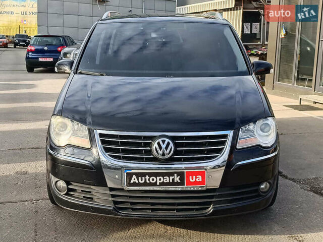 Черный Фольксваген Туран, объемом двигателя 2 л и пробегом 260 тыс. км за 9390 $, фото 1 на Automoto.ua