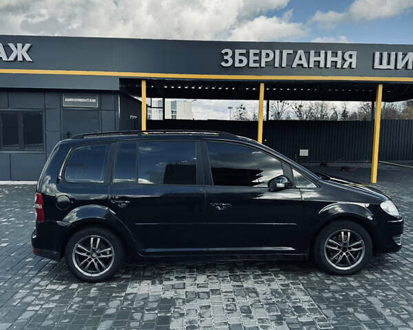 Черный Фольксваген Туран, объемом двигателя 1.39 л и пробегом 242 тыс. км за 7500 $, фото 6 на Automoto.ua