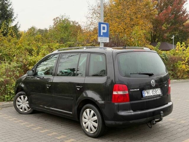 Черный Фольксваген Туран, объемом двигателя 1.9 л и пробегом 225 тыс. км за 2450 $, фото 2 на Automoto.ua