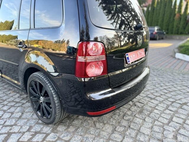 Черный Фольксваген Туран, объемом двигателя 1.4 л и пробегом 200 тыс. км за 7300 $, фото 1 на Automoto.ua