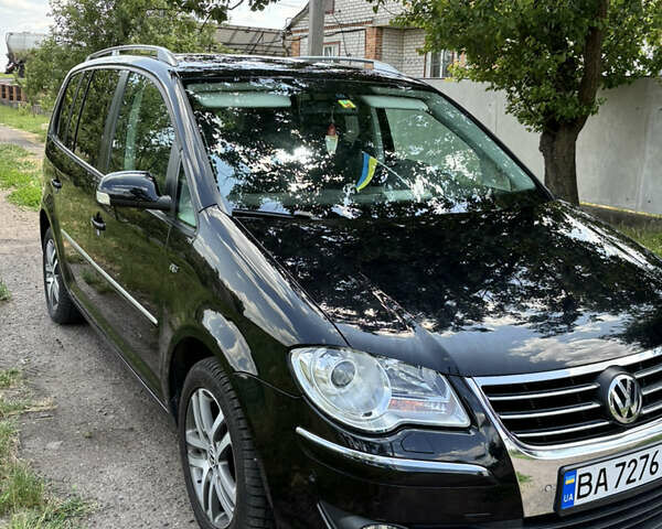 Черный Фольксваген Туран, объемом двигателя 1.39 л и пробегом 191 тыс. км за 8500 $, фото 2 на Automoto.ua