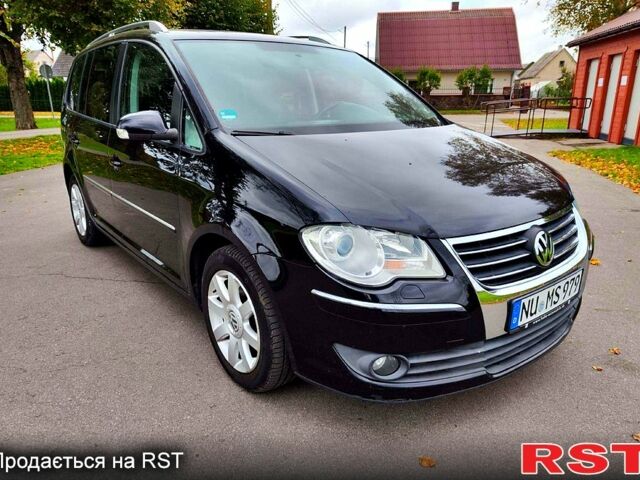 Черный Фольксваген Туран, объемом двигателя 2 л и пробегом 318 тыс. км за 2400 $, фото 6 на Automoto.ua