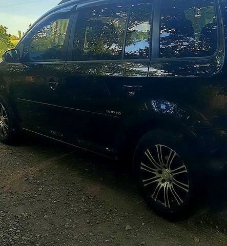 Черный Фольксваген Туран, объемом двигателя 1.4 л и пробегом 242 тыс. км за 7500 $, фото 1 на Automoto.ua