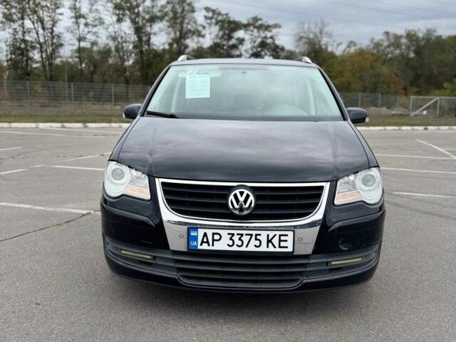 Черный Фольксваген Туран, объемом двигателя 1.4 л и пробегом 211 тыс. км за 7100 $, фото 1 на Automoto.ua